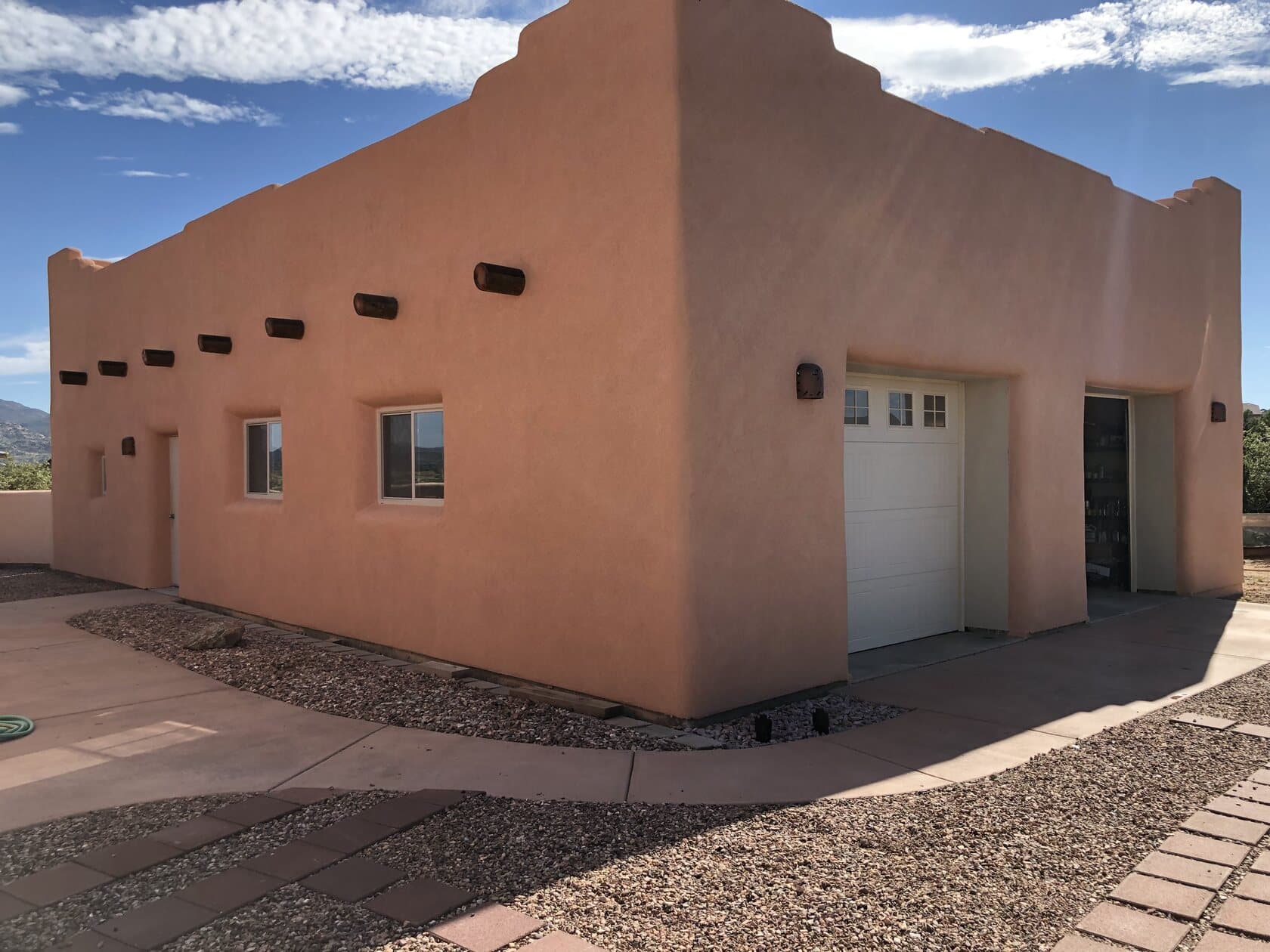 A santa-fe smooth stucco home finished by New Generation Plastering